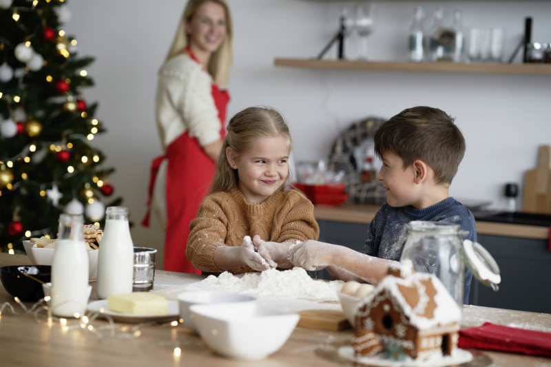 Children having fun while baking Chirstmas cookies