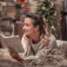 Woman reading a book in a cozy home Christmas atmosphere