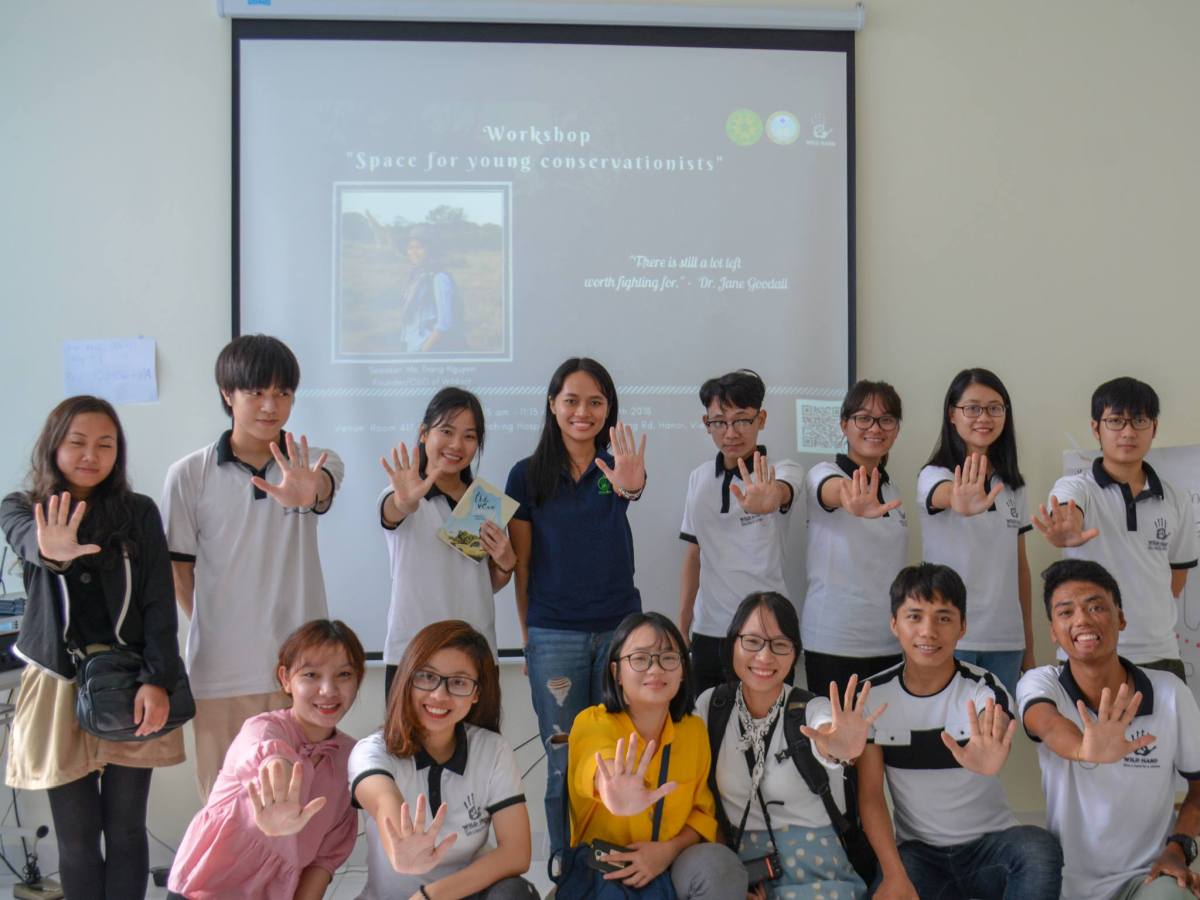 Dr. Nguyen with young participants at a workshop