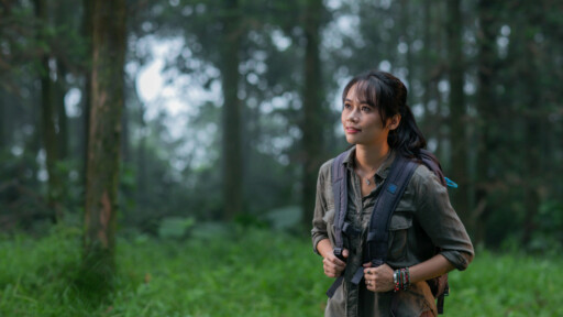 Dr. Trang Nguyen exploring a forest environment, highlighting her hands-on work in wildlife conservation and research. Source: Trang Nguyen