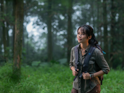 Dr. Trang Nguyen exploring a forest environment, highlighting her hands-on work in wildlife conservation and research. Source: Trang Nguyen