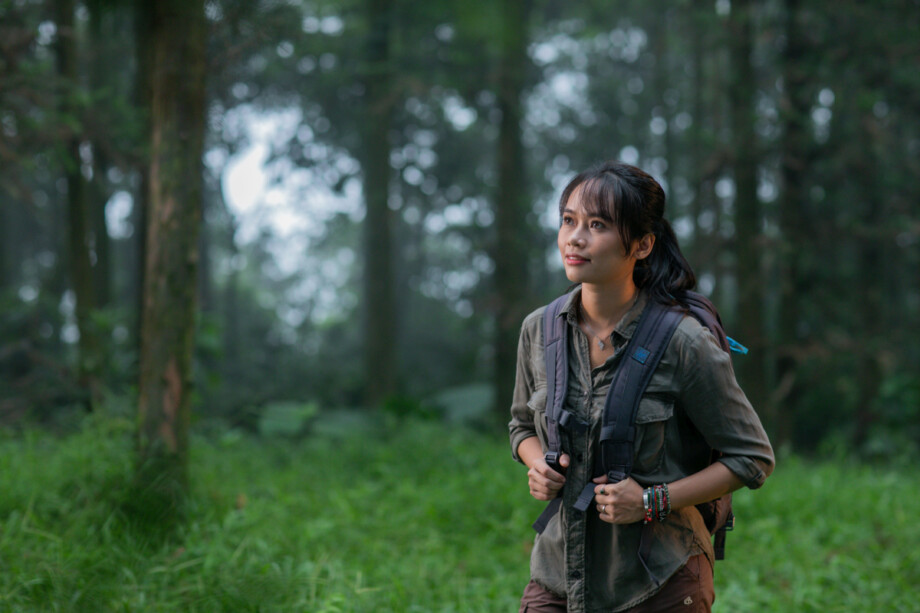 Dr. Trang Nguyen exploring a forest environment, highlighting her hands-on work in wildlife conservation and research. Source: Trang Nguyen
