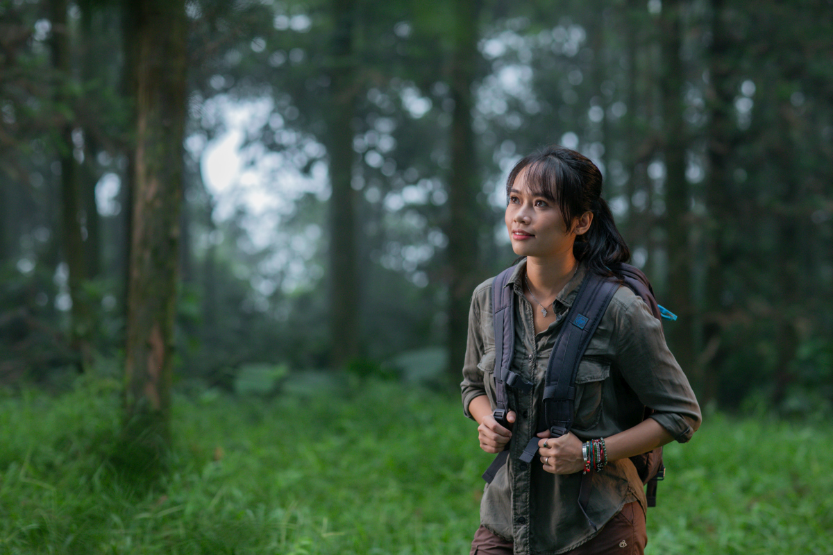 Dr. Trang Nguyen exploring a forest environment, highlighting her hands-on work in wildlife conservation and research. Source: Trang Nguyen