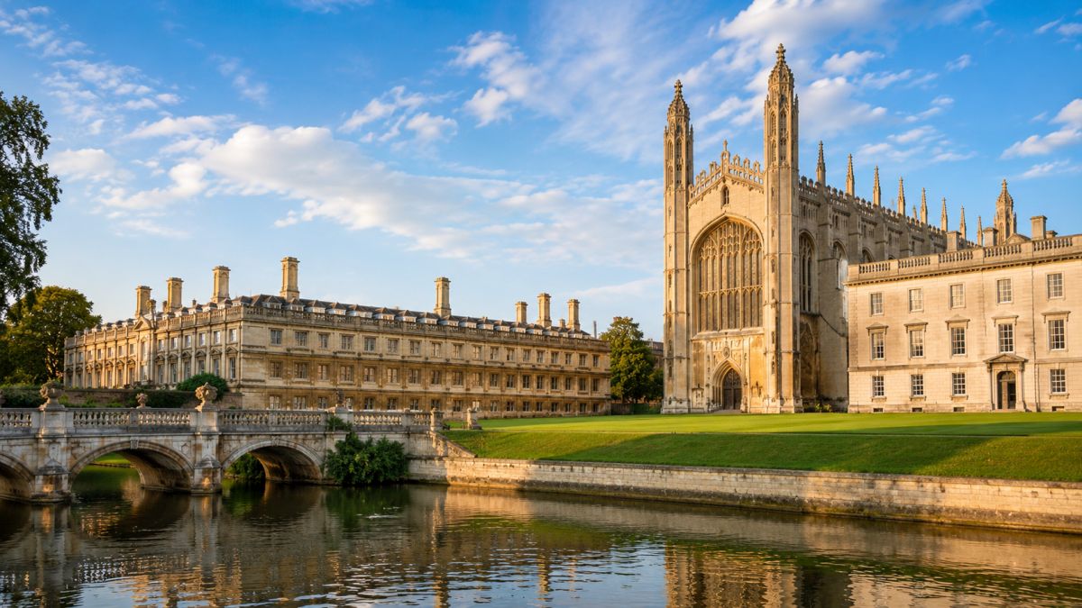 Historic University of Cambridge buildings reflected in the River Cam, featuring Gothic architecture, a stone bridge; Image created with AI