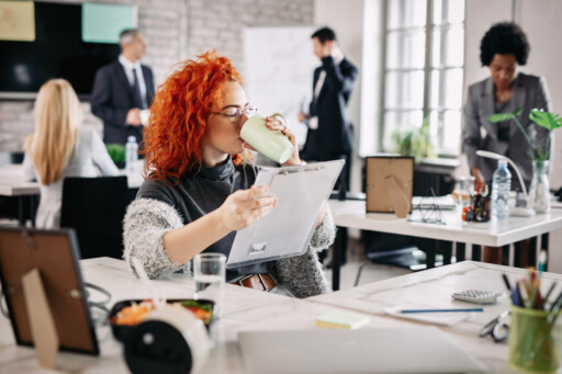 Professional woman reviewing documents while enjoying a coffee break in a modern office;, Source: https://www.magnific.com/free-photo/female-entrepreneur-reading-business-reports-drinking-coffee-while-sitting-her-desk-office-there-are-people-background_25482144.htm