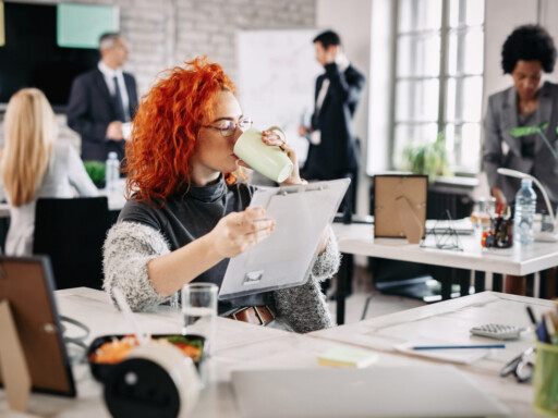 Professional woman reviewing documents while enjoying a coffee break in a modern office;, Source: https://www.magnific.com/free-photo/female-entrepreneur-reading-business-reports-drinking-coffee-while-sitting-her-desk-office-there-are-people-background_25482144.htm