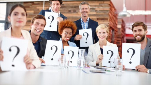 Diverse group of professionals holding question mark signs during a business model quiz. Source: https://www.magnific.com/premium-photo/question-mark-corporate-people-meeting-with-card-input-feedback-market-research-opinion-team-focus-group-workplace-with-paper-decision-employee-test-consumer-growth_423375972.htm