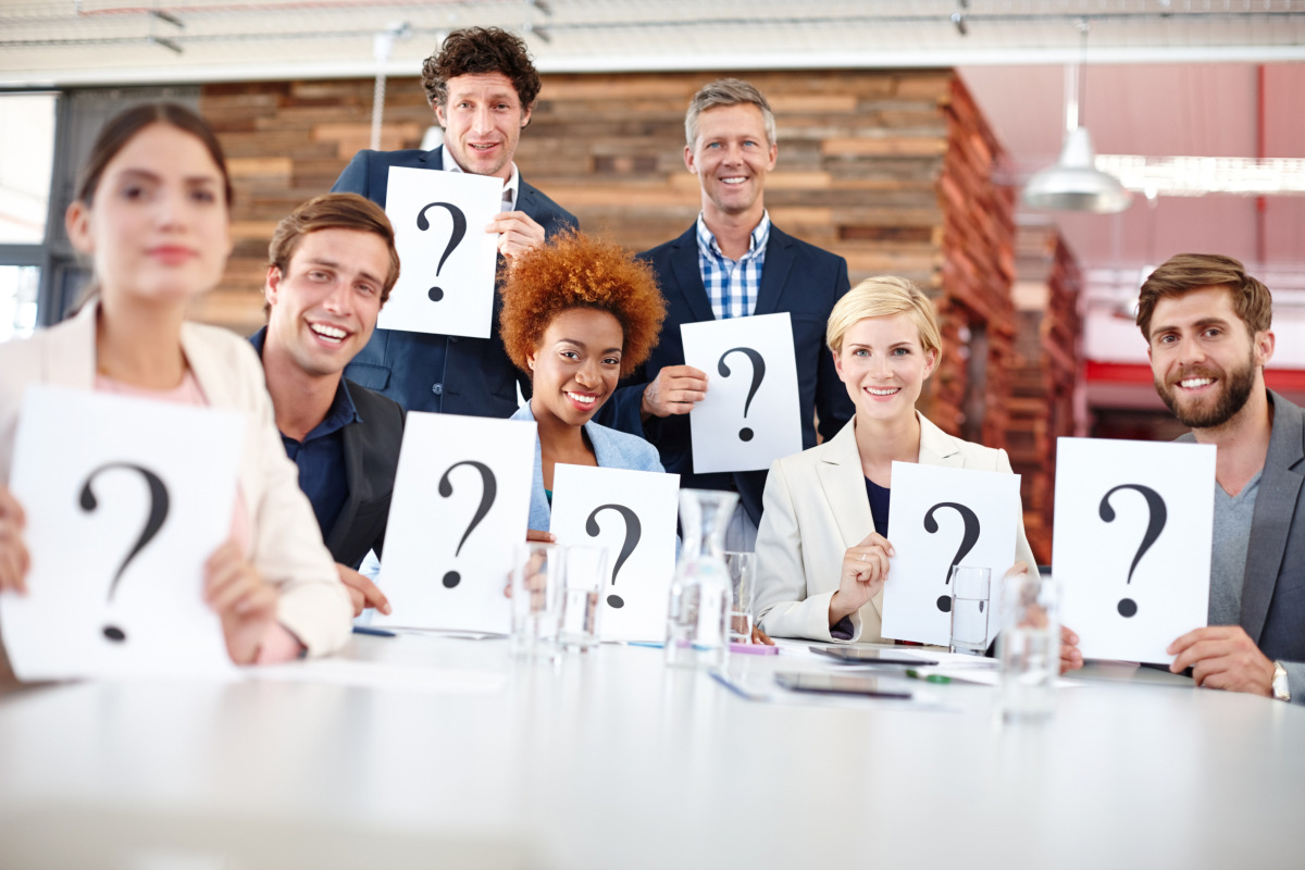 Diverse group of professionals holding question mark signs during a business model quiz. Source: https://www.magnific.com/premium-photo/question-mark-corporate-people-meeting-with-card-input-feedback-market-research-opinion-team-focus-group-workplace-with-paper-decision-employee-test-consumer-growth_423375972.htm