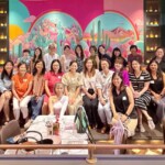Members of the Mumpreneurs Go Places community pose for a group photo in front of a colorful mural. Photo credit: Photo courtesy of Katherine Lu.