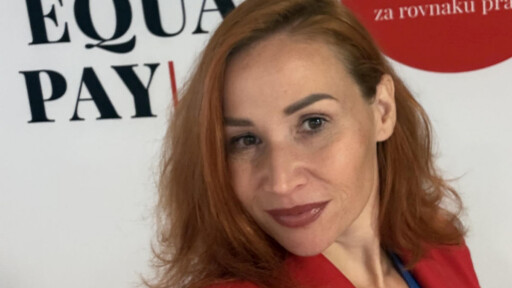 Alt text: Simona Tarnóczy wearing a red blazer at an Equal Pay event Photo credit: Photo courtesy of Simona Tarnóczy.