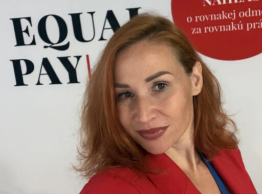 Alt text: Simona Tarnóczy wearing a red blazer at an Equal Pay event Photo credit: Photo courtesy of Simona Tarnóczy.
