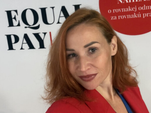 Alt text: Simona Tarnóczy wearing a red blazer at an Equal Pay event Photo credit: Photo courtesy of Simona Tarnóczy.